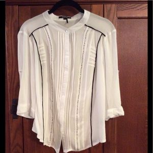 Roly Poly semi sheer blouse with black accents.